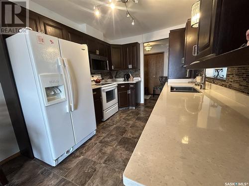 203 408 Heritage Drive, Estevan, SK - Indoor Photo Showing Kitchen With Double Sink