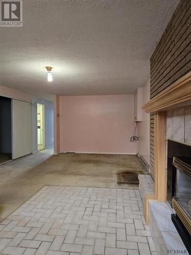 197 Roland Rd, Temiskaming Shores, ON - Indoor Photo Showing Other Room With Fireplace