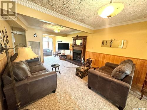 104 Pine Street, Chitek Lake, SK - Indoor Photo Showing Living Room With Fireplace