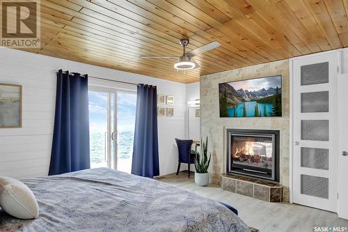 148 Katepwa Drive S, Katepwa Beach, SK - Indoor Photo Showing Bedroom With Fireplace