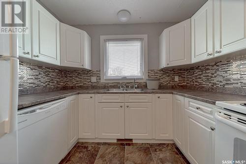 7301-7303 Bowman Avenue, Regina, SK - Indoor Photo Showing Kitchen With Double Sink