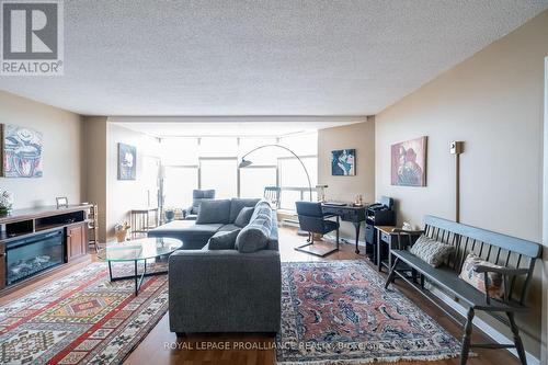 #404 -350 Front St, Belleville, ON - Indoor Photo Showing Living Room With Fireplace