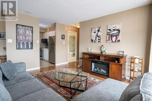 #404 -350 Front St, Belleville, ON - Indoor Photo Showing Living Room With Fireplace
