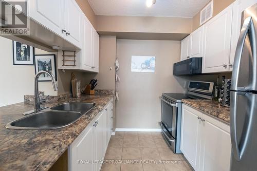 #404 -350 Front St, Belleville, ON - Indoor Photo Showing Kitchen With Double Sink