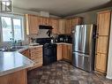 71 3889 Muller Avenue, Terrace, BC  - Indoor Photo Showing Kitchen With Double Sink 