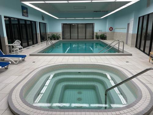 Spa - 204-21 Ch. Du Bord-Du-Lac-Lakeshore, Pointe-Claire, QC - Indoor Photo Showing Other Room With In Ground Pool