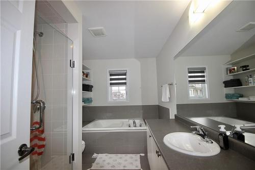 4 piece ensuite with separate tub & shower - 57 Thompson Road, Caledonia, ON - Indoor Photo Showing Bathroom