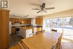 Spacious and bright dining area with access to deck. - 