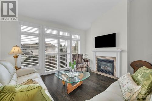 106 Passageway Private, Kanata, ON - Indoor Photo Showing Living Room With Fireplace