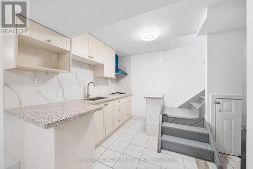 22 Chelmsford Ave, Toronto, ON - Indoor Photo Showing Kitchen With Double Sink