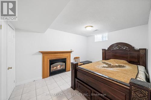 22 Chelmsford Ave, Toronto, ON - Indoor Photo Showing Bedroom With Fireplace