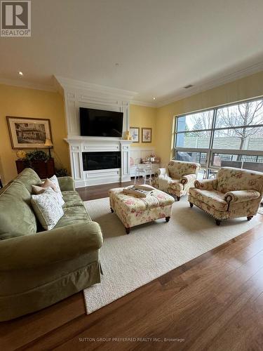 111 - 1705 Fiddlehead Place, London, ON - Indoor Photo Showing Living Room With Fireplace