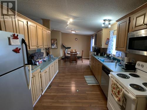 5112 42 Street, Fort Nelson, BC - Indoor Photo Showing Kitchen With Double Sink
