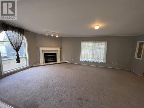 5412 51 Street, Fort Nelson, BC - Indoor Photo Showing Living Room With Fireplace