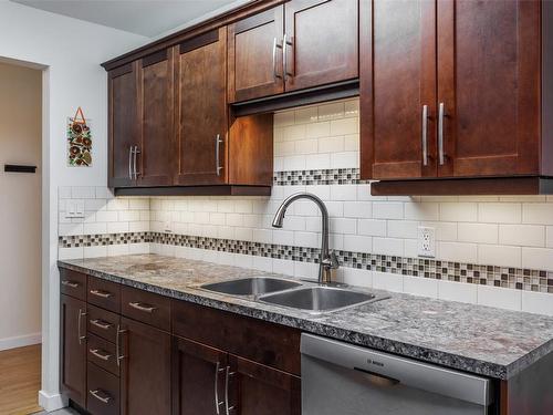 203-1056 Bernard Avenue, Kelowna, BC - Indoor Photo Showing Kitchen With Double Sink