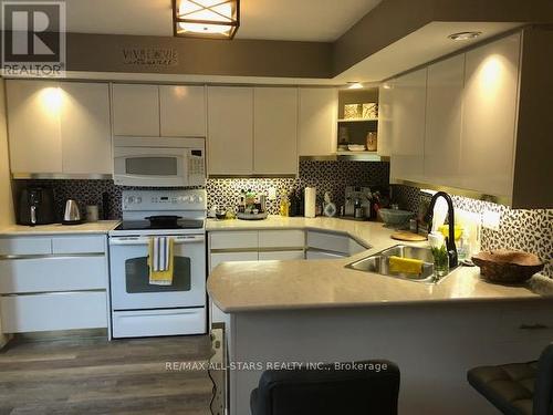 #204 -1 Sherwood St, Kawartha Lakes, ON - Indoor Photo Showing Kitchen With Double Sink