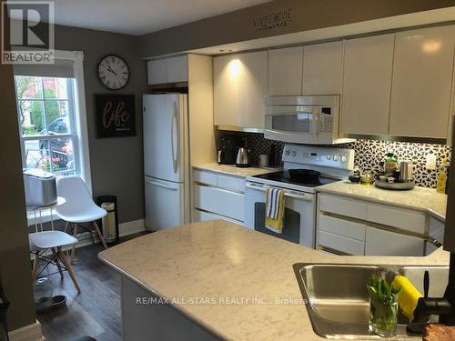 204 - 1 Sherwood Street, Kawartha Lakes, ON - Indoor Photo Showing Kitchen With Double Sink