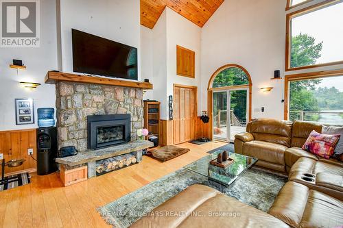 1013 Merrick Drive, Bracebridge, ON - Indoor Photo Showing Living Room With Fireplace