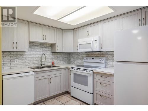 3175 De Montreuil Court Unit# 305, Kelowna, BC - Indoor Photo Showing Kitchen With Double Sink