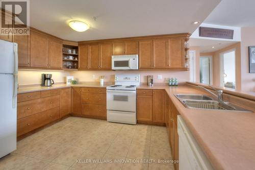 #216 -20 Station Sq, Centre Wellington, ON - Indoor Photo Showing Kitchen With Double Sink