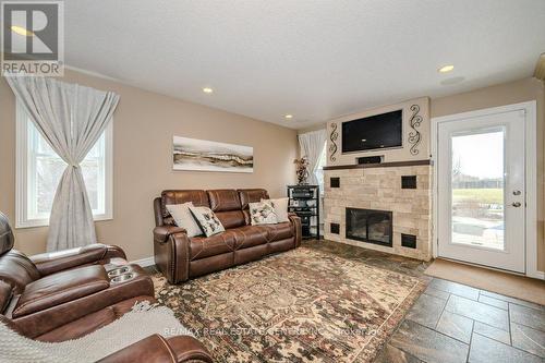 6954 Fife Rd, Guelph/Eramosa, ON - Indoor Photo Showing Living Room With Fireplace