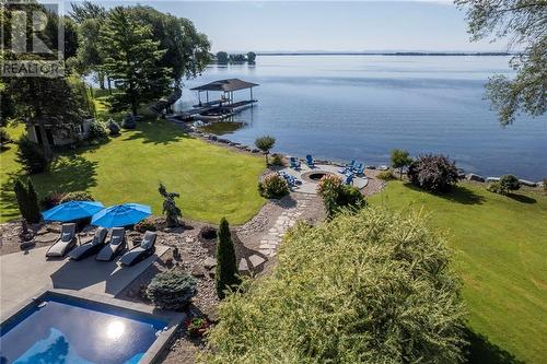 Heated Inground Pool, fire pit, Boat Slip, Lake St Francis, Shipping Channel, and view of Adirondack Mountains in the distance - 20288 County Road 2 Road, South Glengarry, ON - Outdoor With Body Of Water With View