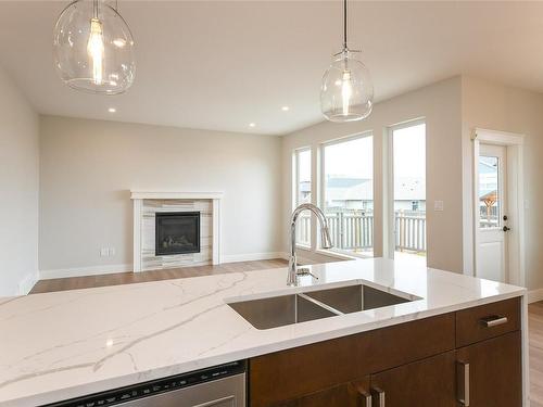3402 Eagleview Cres, Courtenay, BC - Indoor Photo Showing Kitchen With Fireplace With Double Sink