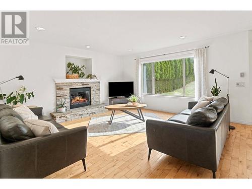 4857 Canyon Ridge Crescent, Kelowna, BC - Indoor Photo Showing Living Room With Fireplace