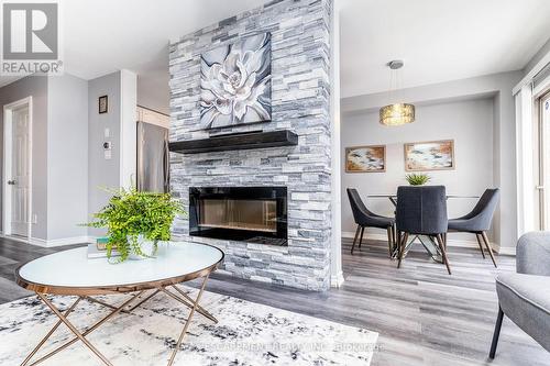 #53 -565 Rymal Rd E, Hamilton, ON - Indoor Photo Showing Living Room With Fireplace