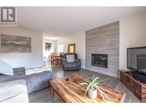 110 Skaha Place Unit# 410, Penticton, BC - Indoor Photo Showing Living Room With Fireplace