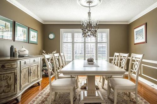 The amply sized Dining Room offers space for large gatherings. - 1652 Roundleaf Court, Burlington, ON - Indoor Photo Showing Dining Room