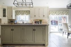 Th Island Cabinetry was repainted in 2023 + Quartz Countertops were replaced in 2023 - 