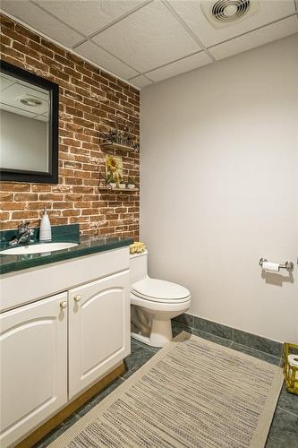 Basement 2-pc Bath updated 2022 - 1652 Roundleaf Court, Burlington, ON - Indoor Photo Showing Bathroom