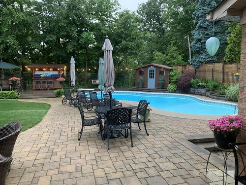View of Salt Water Pool, Tiki Bar, Pool Shed & Fence Painted 2020 - 1652 Roundleaf Court, Burlington, ON - Outdoor With In Ground Pool With Deck Patio Veranda