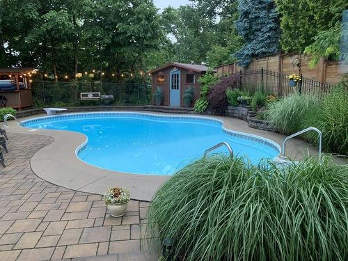 Filter System/Pump 2023, Salt Water Pool Liner Newly Sealed 2022 - 1652 Roundleaf Court, Burlington, ON - Outdoor With In Ground Pool With Backyard
