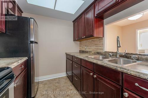 434 - 8351 Mclaughlin Road W, Brampton, ON - Indoor Photo Showing Kitchen With Double Sink