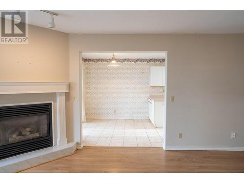 Unit #215, 4630 Ponderosa Drive, Peachland, BC - Indoor Photo Showing Living Room With Fireplace