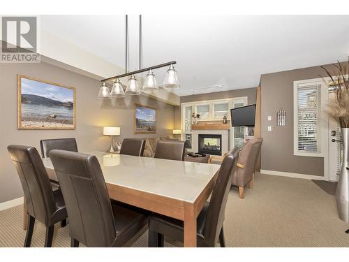 7343 Okanagan Landing Road Unit# 1121, Vernon, BC - Indoor Photo Showing Dining Room With Fireplace