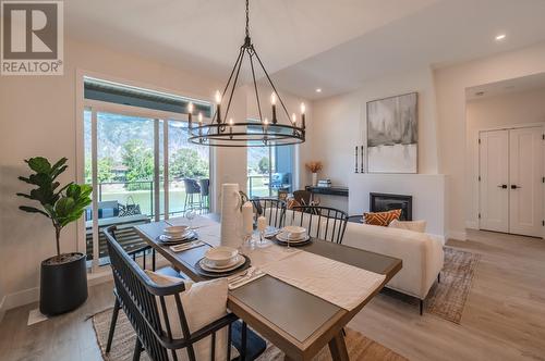 8000 Vedette Drive Unit# 12, Osoyoos, BC - Indoor Photo Showing Dining Room With Fireplace