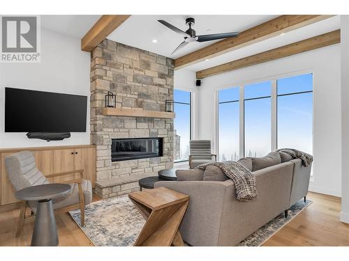 255 Feathertop Way Unit# 82, Big White, BC - Indoor Photo Showing Living Room With Fireplace