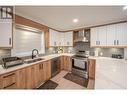 10615 Elliott Street Unit# 105, Summerland, BC  - Indoor Photo Showing Kitchen With Double Sink 