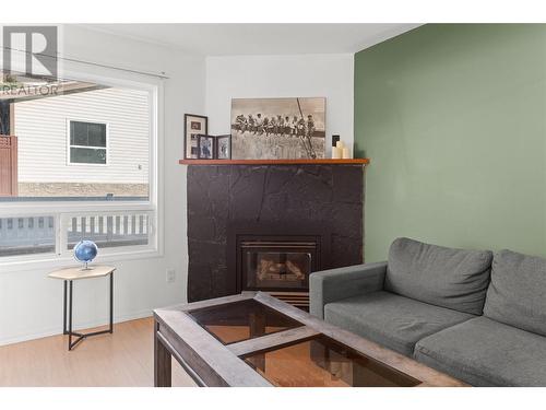 763 Eckhardt Avenue E Unit# 102, Penticton, BC - Indoor Photo Showing Living Room With Fireplace