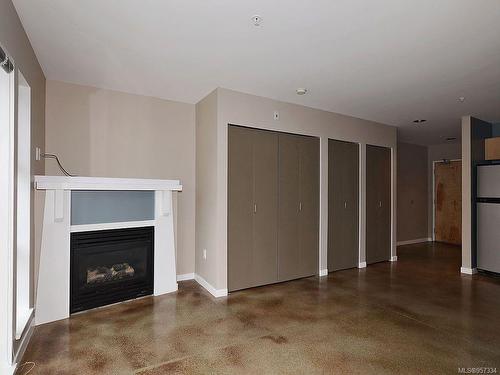 104-90 Regatta Landing, Victoria, BC - Indoor Photo Showing Living Room With Fireplace