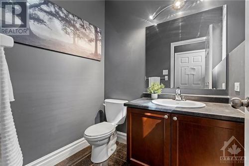 1/2 bath off of main floor - 218 Hillpark High Street, Ottawa, ON - Indoor Photo Showing Bathroom