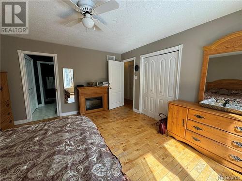 16 Hallihan Lane, Blackville, NB - Indoor Photo Showing Bedroom With Fireplace