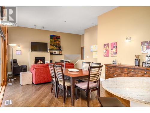 9845 Eastside Road Unit# 31, Vernon, BC - Indoor Photo Showing Dining Room With Fireplace