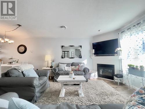 99 Calgary Avenue Unit# 104, Penticton, BC - Indoor Photo Showing Living Room With Fireplace