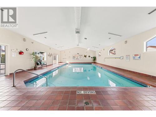 609 Truswell Road Unit# 159, Kelowna, BC - Indoor Photo Showing Other Room With In Ground Pool