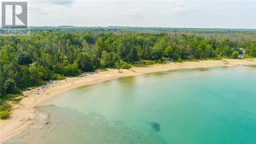 Nestled in the most desirable neighbourhood of Port Elgin - Gobles Grove Beach - you'll find the peace and tranquility you've been seeking, with a perfect balance of quietude and natural beauty. - 3 George Street, Saugeen Shores, ON - Outdoor With Body Of Water With View