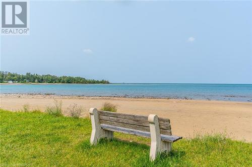 Gobles Grove Beach offers miles of sandy shoreline, where you can relax and unwind amidst the calming sounds of the waves. - 3 George Street, Saugeen Shores, ON - Outdoor With Body Of Water With View